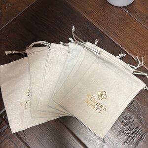 Kendra Scott Cream Pouches with Gold Logo